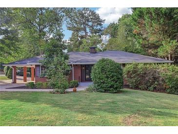 Brick ranch home with carport and well-maintained lawn at 2347 Lavista Ne Rd, Atlanta, GA 30329