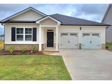 Charming one-story house with a two-car garage at 134 Oakchase Park Ln, Hampton, GA 30228