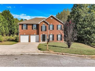 Two story brick home with attached garage at 2146 Silva Ct, Conley, GA 30288