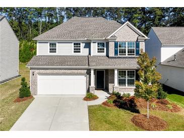 Two story home with gray siding and brick accents at 6019 Wheeler Ridge Rd, Auburn, GA 30011