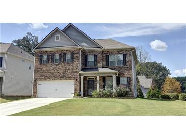 Two-story brick house with landscaped yard at 222 Gallant Fox Way, Acworth, GA 30102