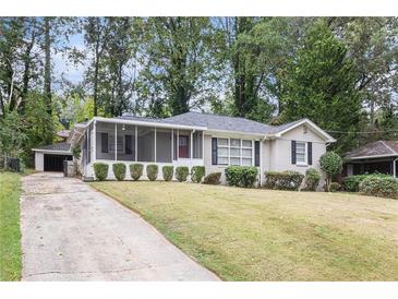 Charming ranch home with screened porch and landscaped yard at 2354 Woodhill Ln, Atlanta, GA 30344