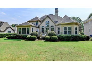 Spacious backyard with lush lawn and large deck at 8015 St Marlo Country Club Pkwy, Duluth, GA 30097