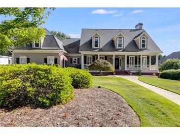 Two story house with wrap around porch at 8561 Lake Forrest Dr, Douglasville, GA 30134