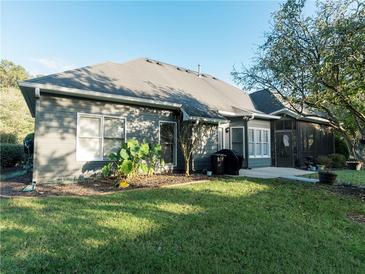 Gray house exterior with screened porch and backyard at 500 Chestnut Walk, Canton, GA 30114
