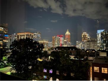 Nighttime view of the city skyline from a high-rise building at 878 Peachtree Ne St # 612, Atlanta, GA 30309