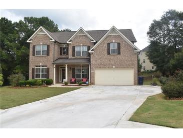 Two story brick home with a two car garage at 3853 Locksley Trl, Douglasville, GA 30135