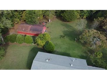 Aerial view showing house and large backyard with detached barn at 2681 Buford Hwy, Cumming, GA 30041
