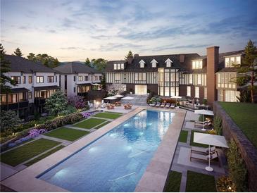 Luxury community pool with surrounding landscaping and lounge area at 1585 S Ponce De Leon Ave # 10, Atlanta, GA 30307