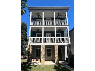 Three-story home with stone base and wrap-around porch at 956 Glenwood Park Se Dr, Atlanta, GA 30316