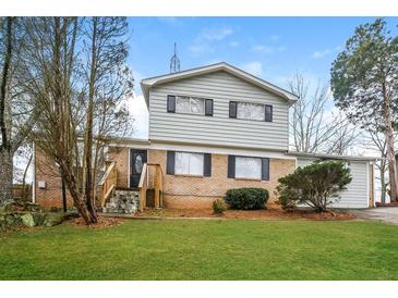 Two story home with brick and siding exterior at 3814 N Camp Creek Sw Pkwy, Atlanta, GA 30331