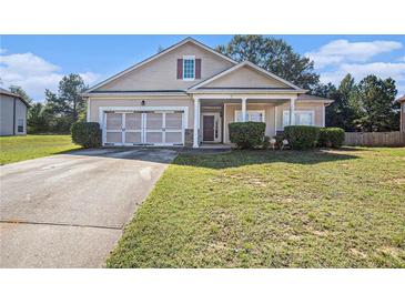 Ranch style home with a two car garage at 421 Bedford Xing, Mcdonough, GA 30253