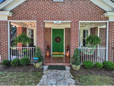 Brick house with green door and porch at 133 Hillside Se Ave, Atlanta, GA 30315