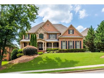 Brick house exterior with manicured lawn and landscaping at 2781 Willowstone Dr, Duluth, GA 30096