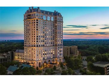 Aerial view of a luxury high rise building at sunset at 88 W Paces Ferry Nw Rd # 1130, Atlanta, GA 30305