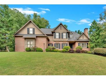 Brick two-story house with a large front yard at 1175 Bowerie Chase, Powder Springs, GA 30127