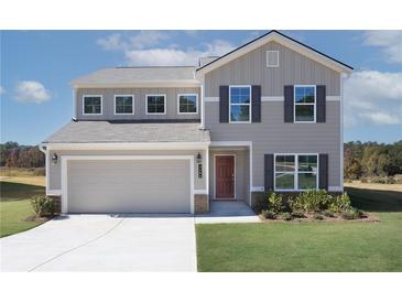 Two-story house with gray siding, a red door and a two car garage at 3280 Forest Green Dr, Douglasville, GA 30135