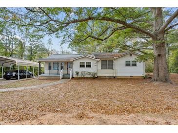 Charming ranch home with carport and mature trees at 3024 Bob Cox Rd, Marietta, GA 30064