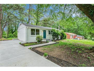 Ranch home with freshly painted brick and teal door at 408 Belgarde Place Se, Atlanta, GA 30354