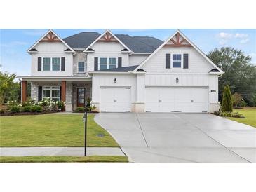 Two-story house, white and gray exterior, double garage at 3330 Carswell Bnd, Cumming, GA 30028