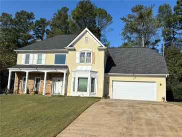 Two-story house with stone accents, large windows, and a two-car garage at 2814 Chapman Way, Marietta, GA 30066