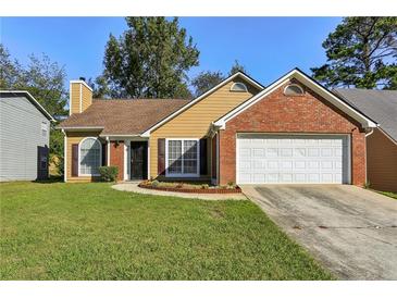 Charming one-story house with attached garage at 6300 Phillips Ct, Lithonia, GA 30058