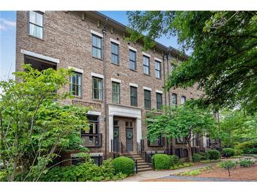 Brick townhomes with lush landscaping and mature trees at 3637 Habersham Nw Rd # 46, Atlanta, GA 30305