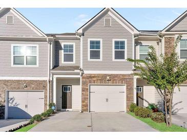 Two-story townhome with two-car garage at 1958 Dillon Dr, Lithonia, GA 30058