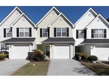Three-unit townhouse building with attached garages and landscaping at 253 Gallant Se # 17, Mableton, GA 30126