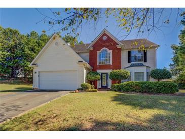 Two story house with brick and siding exterior at 2404 Lake Cove Ct, Lithonia, GA 30058