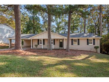 Ranch house with a covered porch and large yard at 2112 Royal Fox Way, Decatur, GA 30032