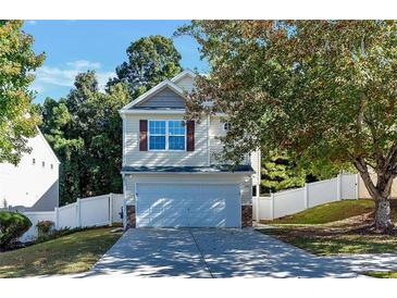 Two-story home with a two-car garage and nice landscaping at 124 Silver Fox Trl, Dallas, GA 30157
