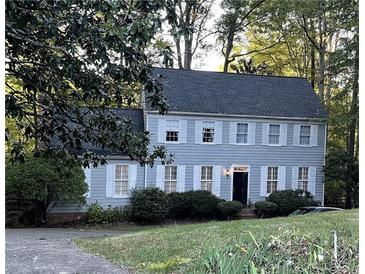 Two-story house with gray siding and white shutters at 220 Spalding Lake Pl, Atlanta, GA 30350