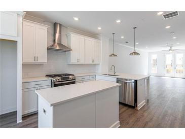 Modern kitchen with white cabinets and island at 344 Olmstead Way # 32, Alpharetta, GA 30022