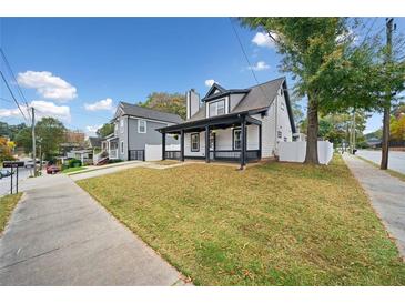 Charming two-story home with a welcoming front porch and landscaped yard at 520 Mary Sw St, Atlanta, GA 30310