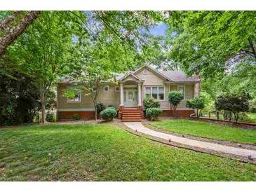 House exterior featuring a landscaped yard and walkway at 721 Smithstone Se Rd, Marietta, GA 30067