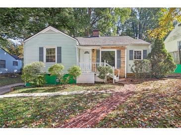 Charming light green house with brick walkway at 1618 Belmont Sw Ave, Atlanta, GA 30310