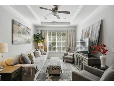 Bright and airy living room with a comfortable seating area and large windows at 10 Perimeter Summit Ne Blvd # 4435, Brookhaven, GA 30319