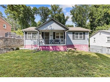 Charming house with a pink base and gray siding at 2243 Tiger Flowers Nw Dr, Atlanta, GA 30314