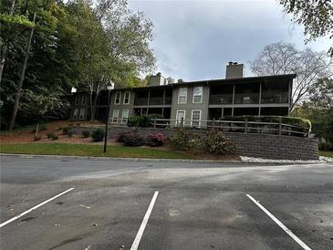 Exterior view of an apartment building with parking at 1101 Lenox Ne Way # 1101, Atlanta, GA 30324