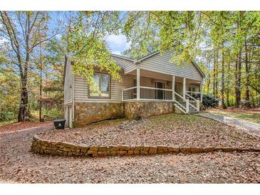 Ranch style home with stone accents and a covered porch at 175 Carriage Gate Dr, Sharpsburg, GA 30277