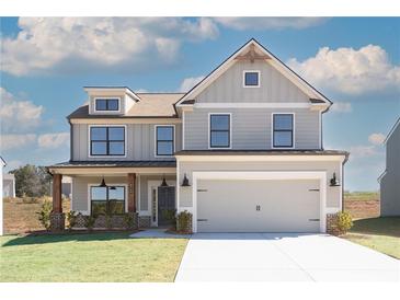 Two-story farmhouse-style home with a large front porch and attached garage at 4140 Chapel Hill Reserve, Douglasville, GA 30135