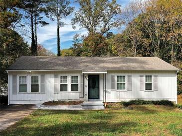 Charming one-story home with white siding at 6185 Bermuda St, Forest Park, GA 30297