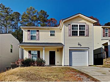 Two-story house with vinyl siding and a driveway at 508 Brady Dr, Villa Rica, GA 30180