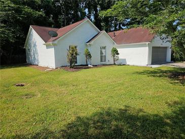 Charming white brick house with a spacious lawn at 4093 Chapel Mill Bnd, Decatur, GA 30034