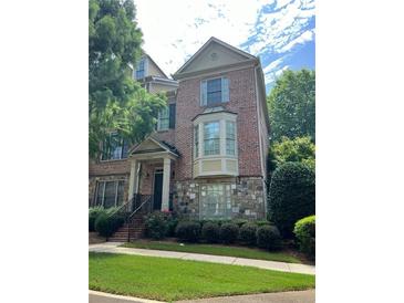 Brick front of charming two-story townhome at 3923 High Dove Sw Way # 16, Smyrna, GA 30082