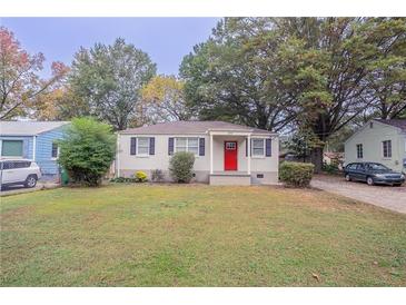 Charming white brick ranch home with a red door at 2519 Godfrey Nw Dr, Atlanta, GA 30318