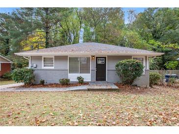 Charming ranch home with gray siding and a black door at 2604 Harmony Way, Atlanta, GA 30344