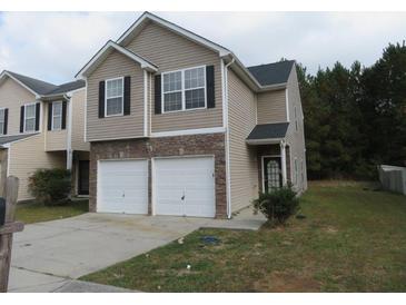 Two-story townhouse with double garage at 6511 Grey Fox Way, Riverdale, GA 30296