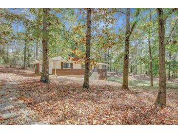 Brick ranch house with wooded backyard at 7030 Cascade Palmetto Hwy, Palmetto, GA 30268